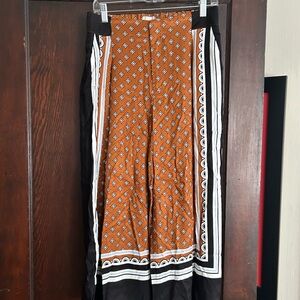 Anthropologie Orange and Black Wide Leg Pants with Striking Pattern
